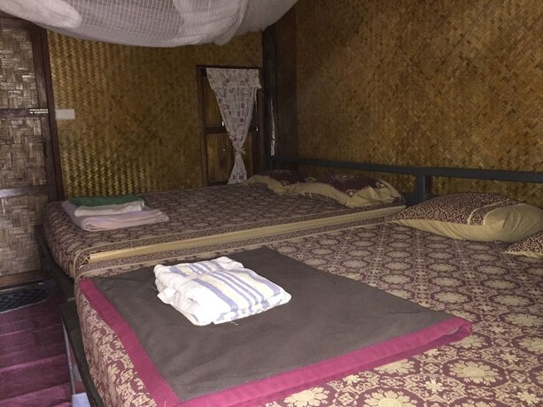 Imagen de la habitación del Hotel Family Huts. Foto 17