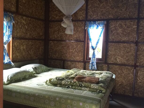 Imagen de la habitación del Hotel Family Huts. Foto 19