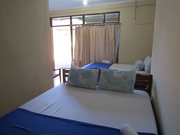 Imagen de la habitación del Hotel Family Syariah 1. Foto 7