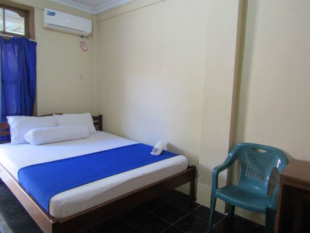 Imagen de la habitación del Hotel Family Syariah 1. Foto 11