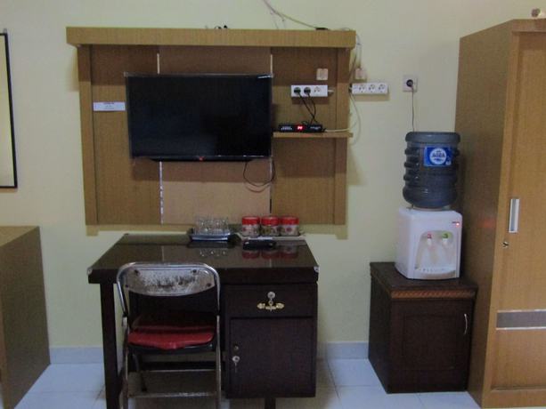 Imagen de la habitación del Hotel Family Syariah 1. Foto 13
