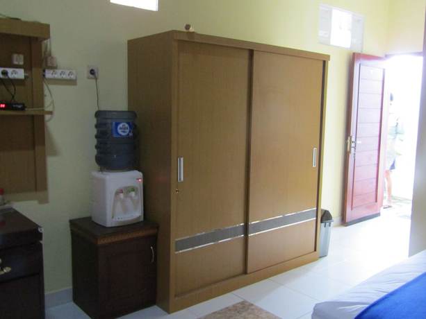 Imagen de la habitación del Hotel Family Syariah 1. Foto 17