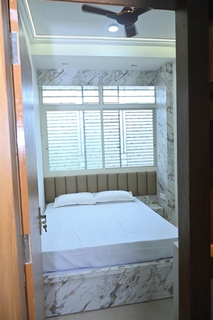 Imagen de la habitación del Hotel Family Ties Homestay. Foto 11