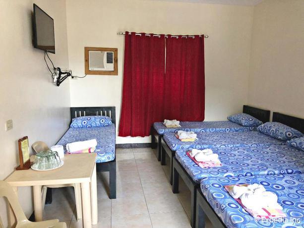 Imagen de la habitación del Hotel Famous Inn. Foto 12
