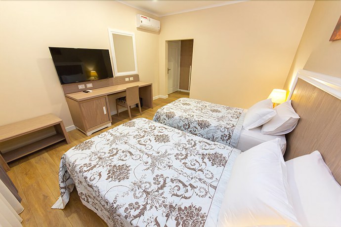 Imagen de la habitación del Hotel FandM. Foto 5