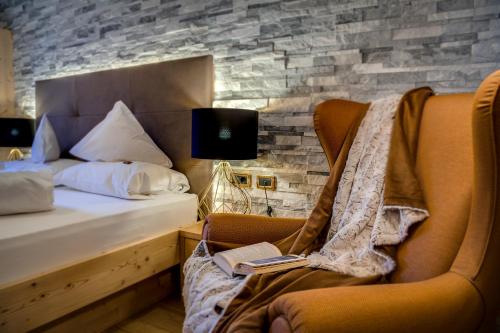 Imagen de la habitación del Hotel Fanes, Selva di Val Gardena. Foto 7