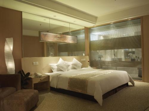 Imagen de la habitación del Hotel Fangyuan Jinling Plaza Hotel. Foto 6
