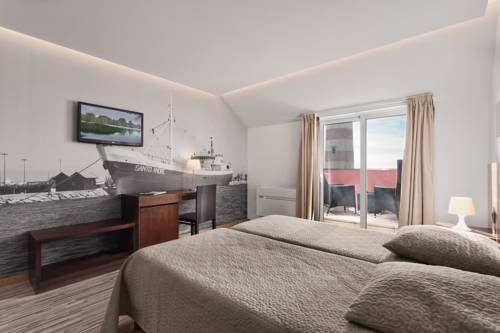 Imagen de la habitación del Hotel Farol, Praia da Barra. Foto 3