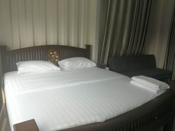 Imagen de la habitación del Hotel Farsai Homestay. Foto 4