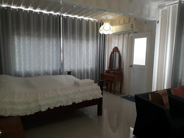 Imagen de la habitación del Hotel Farsai Homestay. Foto 13