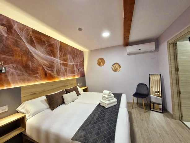 Imagen de la habitación del Hotel Feeling Home - SuitesandRooms. Foto 13