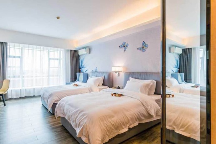 Imagen de la habitación del Hotel Fei Fan Holiday Guangzhou. Foto 3