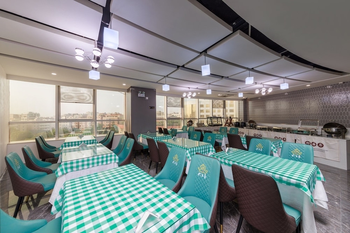 Imagen del bar/restaurante del Hotel Feili Internation. Foto 4