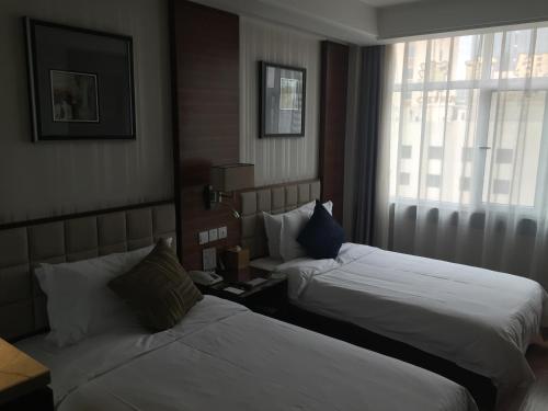 Imagen de la habitación del Hotel Feitian Meiju Baiyin Road Branch. Foto 6