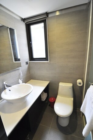 Imagen de la habitación del Hotel Feng Jia 25. Foto 21