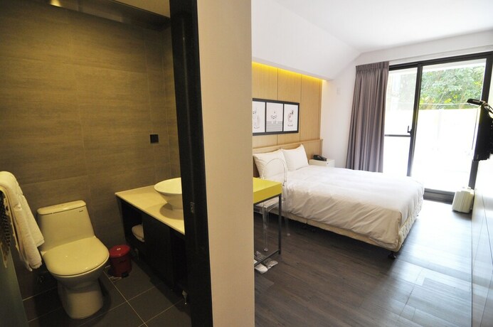 Imagen de la habitación del Hotel Feng Jia 25. Foto 23