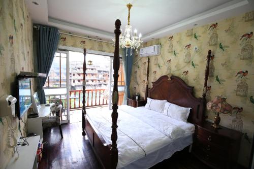 Imagen de la habitación del Hotel Fenghuang 1st Apartment. Foto 8