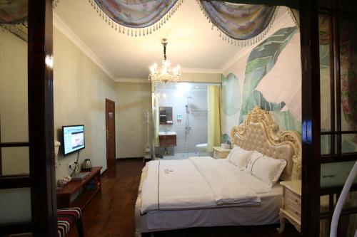 Imagen de la habitación del Hotel Fenghuang 1st Apartment. Foto 9