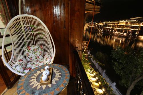 Imagen de la habitación del Hotel Fenghuang 1st Apartment. Foto 10