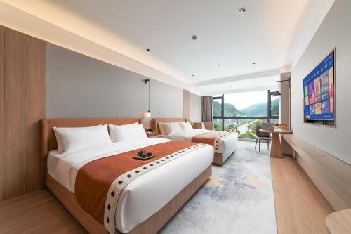 Imagen de la habitación del Hotel Fenghuang Allin Forest Hot Spring International. Foto 16