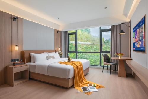 Imagen de la habitación del Hotel Fenghuang Allin Forest Hot Spring International. Foto 19