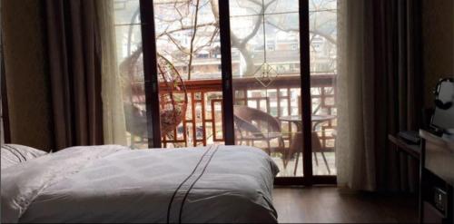 Imagen de la habitación del Hotel Fenghuang Fengyuxuan Boutique Guesthouse ( Fenghua. Foto 9