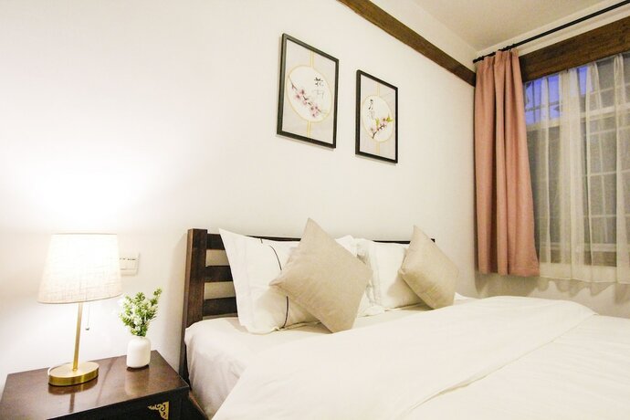 Imagen general del Hotel Fenghuang Hemu House. Foto 5