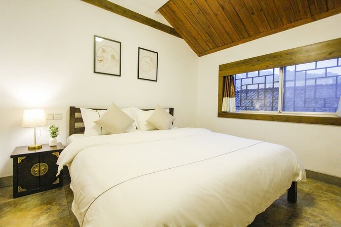 Imagen general del Hotel Fenghuang Hemu House. Foto 6