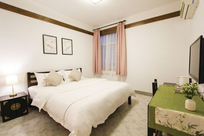 Imagen general del Hotel Fenghuang Hemu House. Foto 10