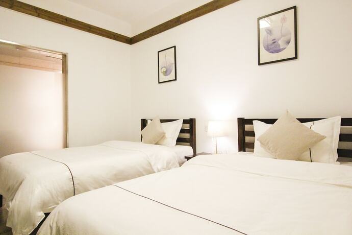 Imagen de la habitación del Hotel Fenghuang Hemu House. Foto 17