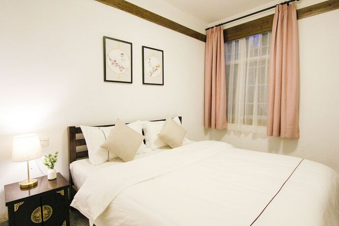 Imagen de la habitación del Hotel Fenghuang Hemu House. Foto 20