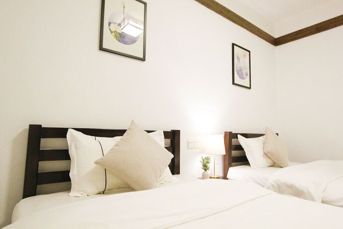 Imagen de la habitación del Hotel Fenghuang Hemu House. Foto 21