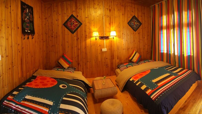 Imagen de la habitación del Hotel Fenghuang Hua Xiang Yuan Inn. Foto 14