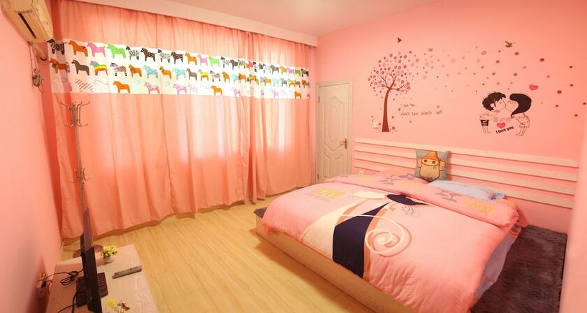 Imagen de la habitación del Hotel Fenghuang Hua Xiang Yuan Inn. Foto 15