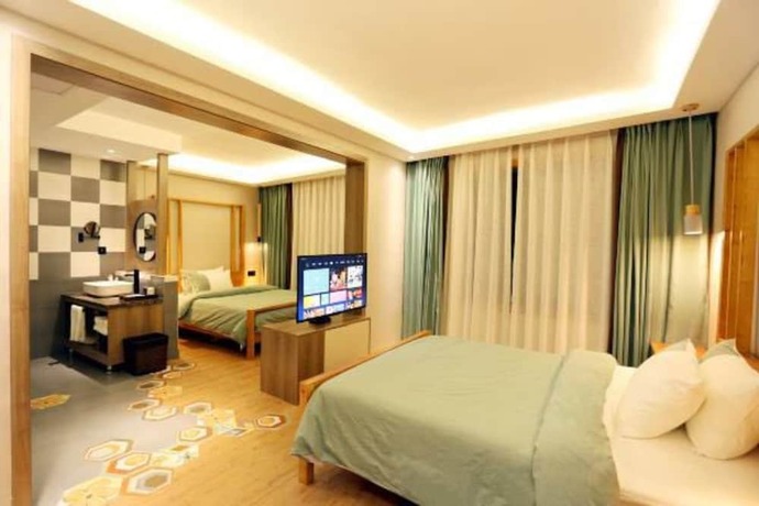 Imagen de la habitación del Hotel Fenghuang Waiting For You Guest House. Foto 11