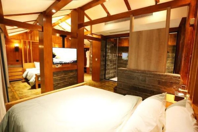 Imagen de la habitación del Hotel Fenghuang Waiting For You Guest House. Foto 12
