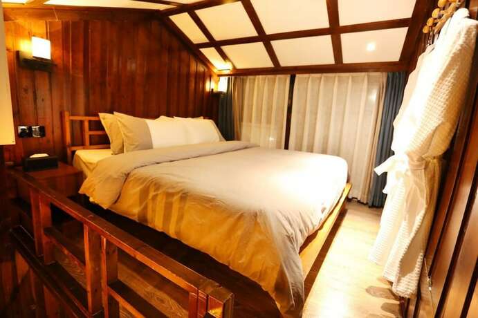 Imagen de la habitación del Hotel Fenghuang Waiting For You Guest House. Foto 14