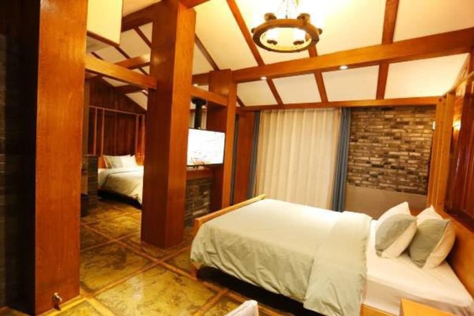 Imagen de la habitación del Hotel Fenghuang Waiting For You Guest House. Foto 15