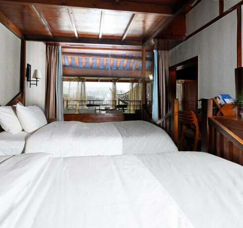 Imagen de la habitación del Hotel Fenghuang Waiting For You Luxe Living. Foto 13