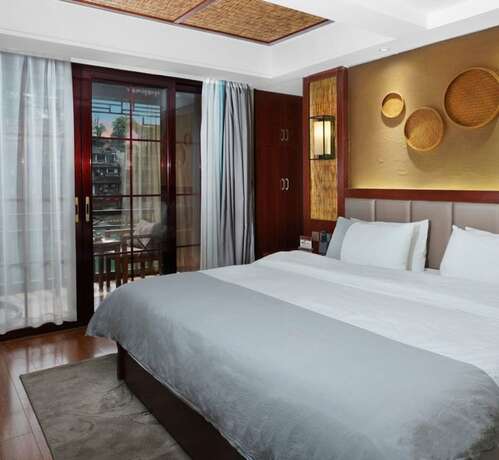 Imagen de la habitación del Hotel Fenghuang Waiting For You Luxe Living. Foto 14