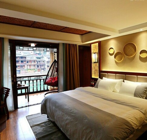 Imagen de la habitación del Hotel Fenghuang Waiting For You Luxe Living. Foto 16