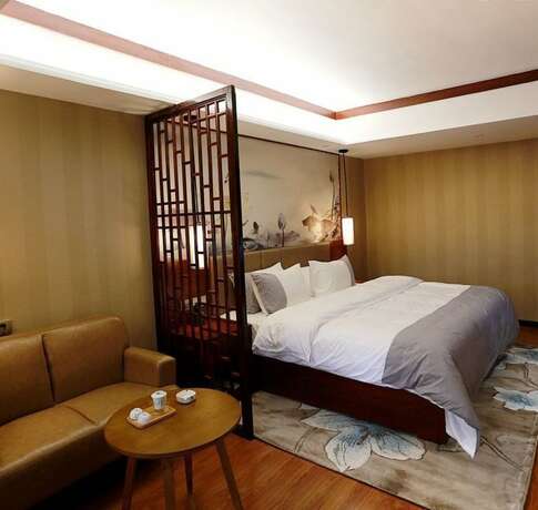 Imagen de la habitación del Hotel Fenghuang Waiting For You Luxe Living. Foto 19
