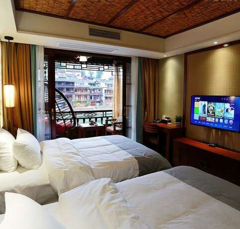 Imagen de la habitación del Hotel Fenghuang Waiting For You Luxe Living. Foto 22