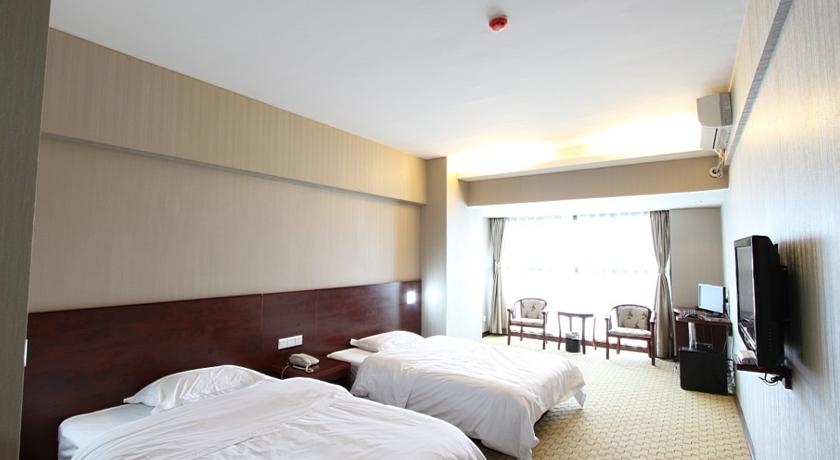 Imagen de la habitación del Hotel Fengyi Hotel. Foto 2