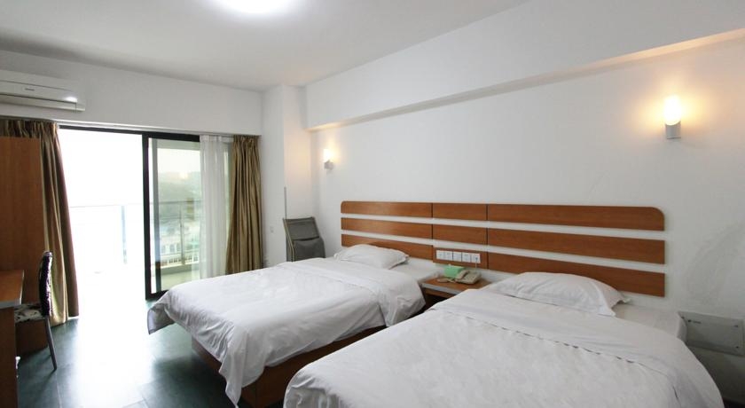 Imagen de la habitación del Hotel Fengyi Hotel. Foto 3
