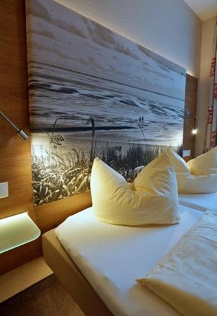 Imagen de la habitación del Hotel Ferienwohnungen Auf Der D&uuml;ne. Foto 6