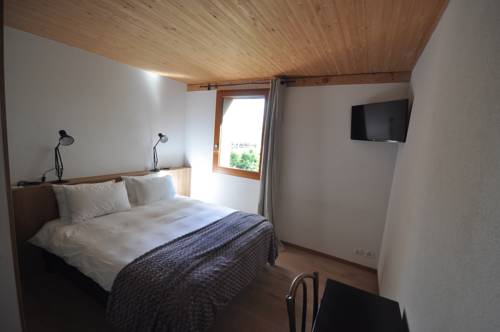 Imagen de la habitación del Hotel Ferme du Lignon. Foto 2