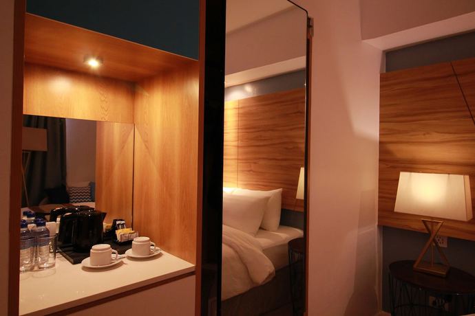 Imagen de la habitación del Hotel Ferra And Garden Suites. Foto 11