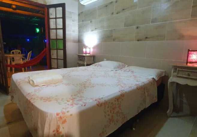 Imagen de la habitación del Hotel Ferrugem Eco Village. Foto 6