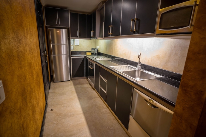 Imagen de la habitación del Hotel Fields Plaza Condo. Foto 16